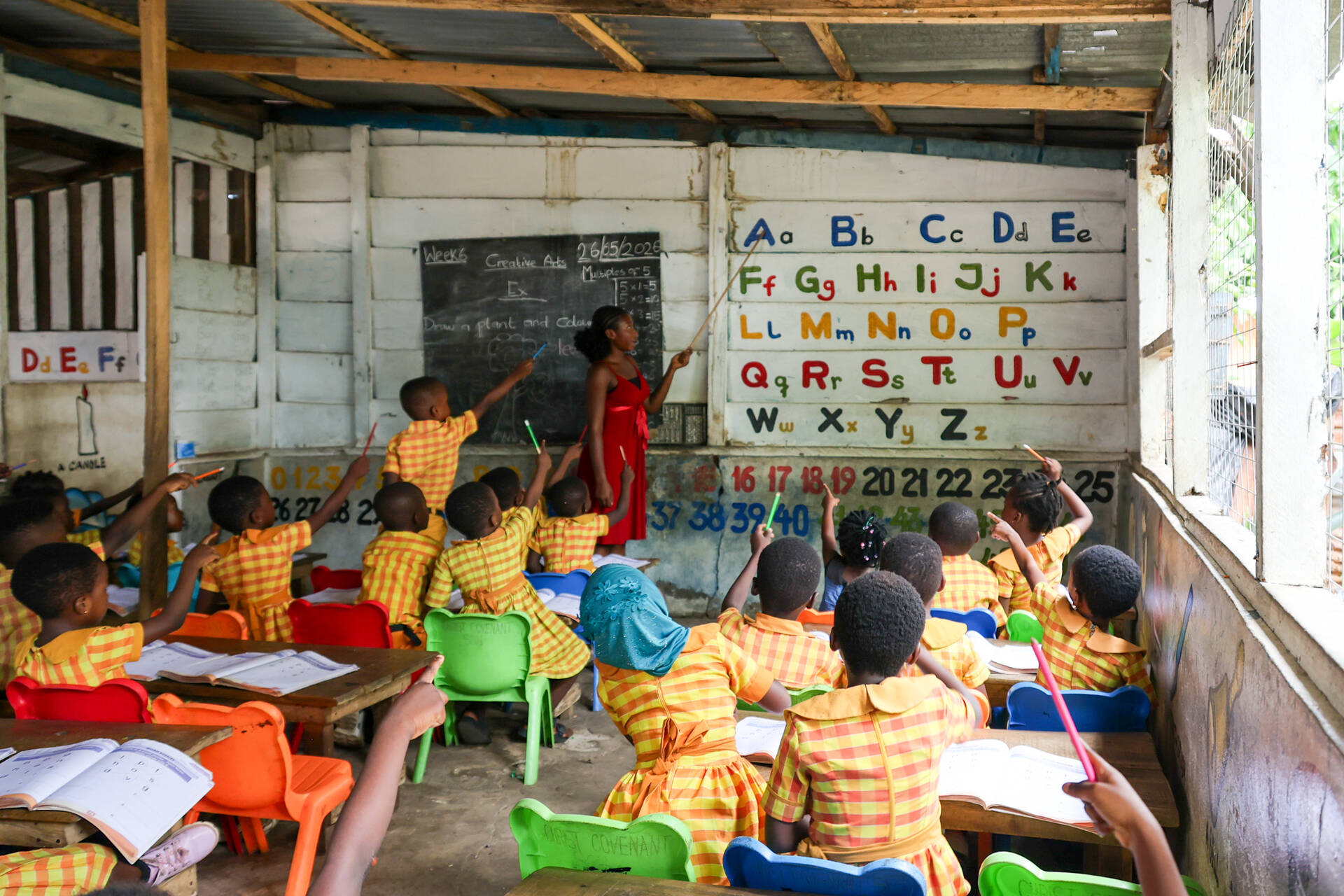 Learners actively participating in class at Holy Covenant School.  Photo Credit: Lumor Bright Elorm/Opportunity International